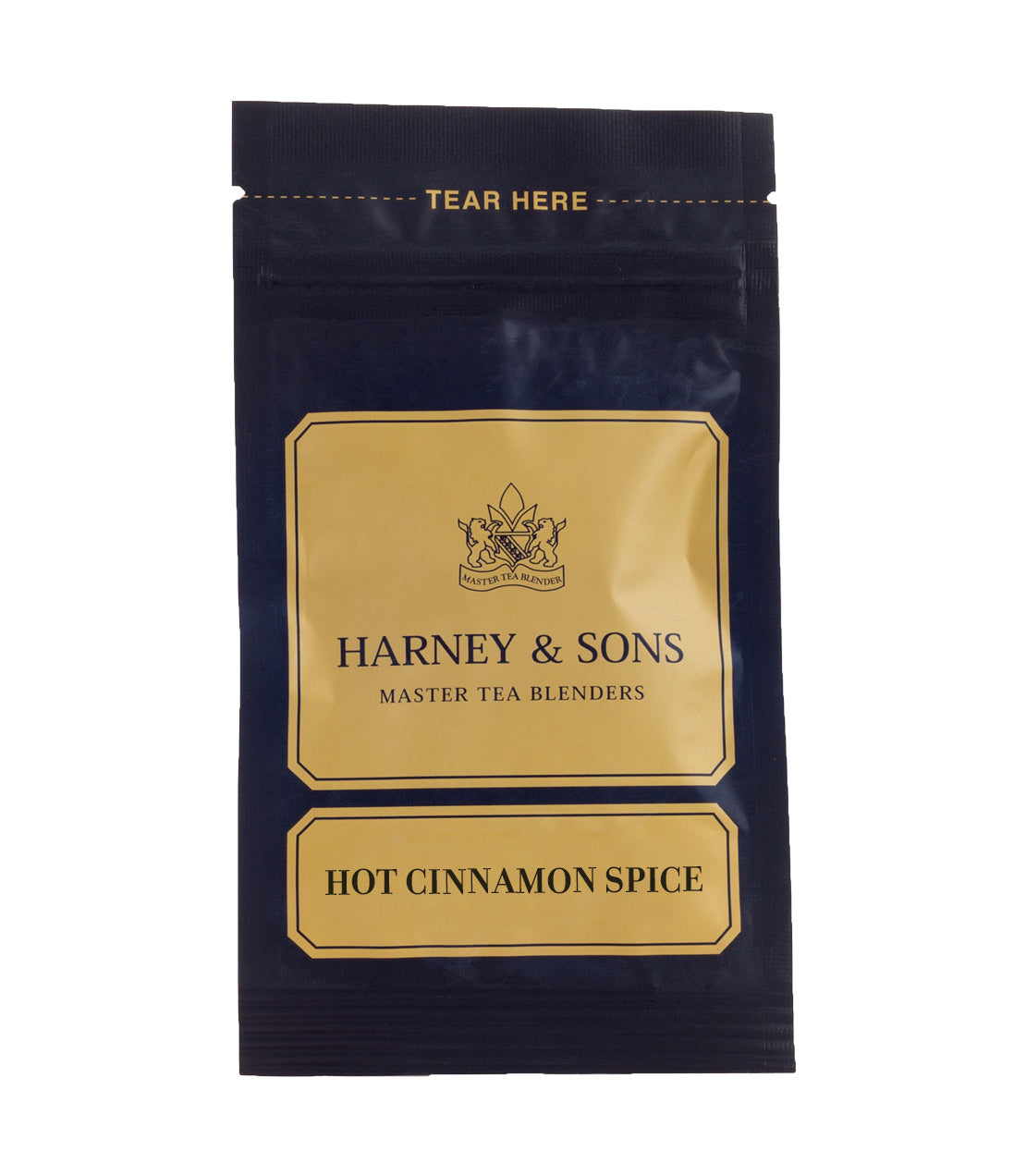 Harney & Sons Hot Cinnamon Spice tea packet, featuring a gold and navy design with tear here label.